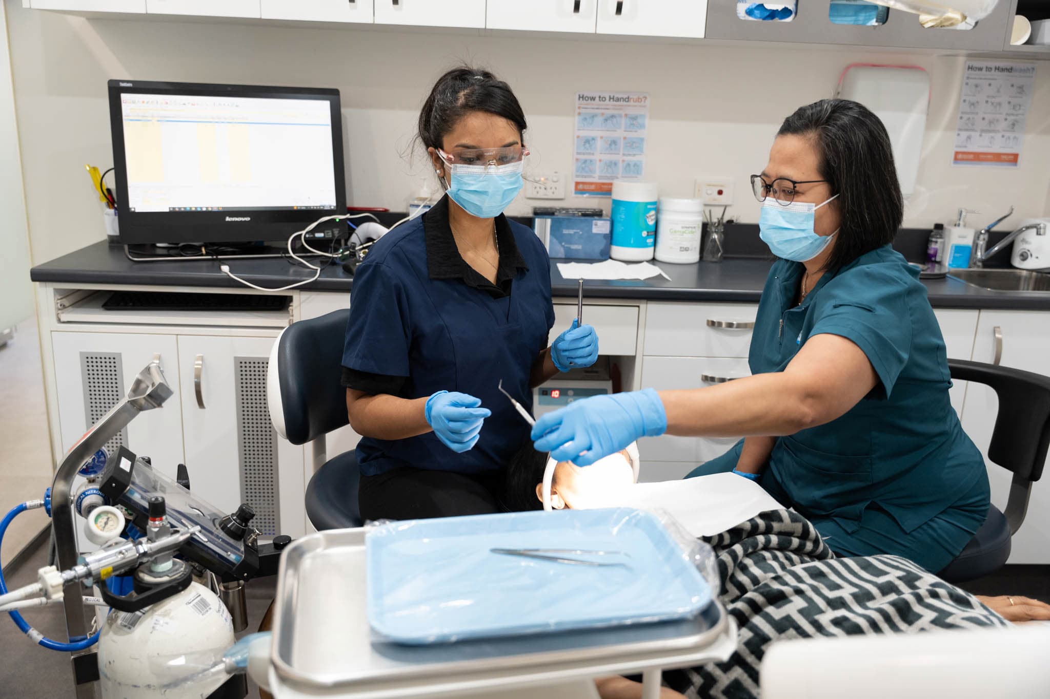 Dentists providing urgent dental emergency care in clinic