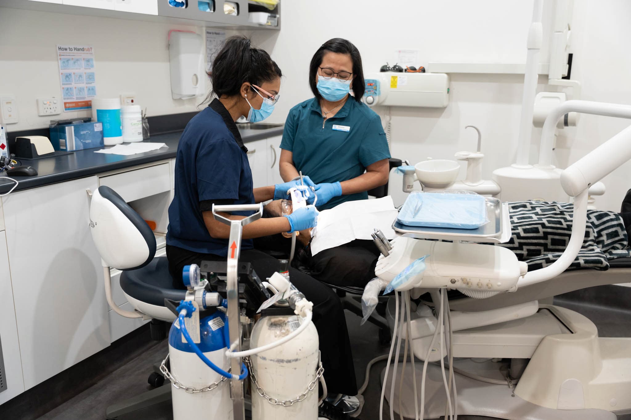 Dental team preparing patient for dental implant procedure in clinic