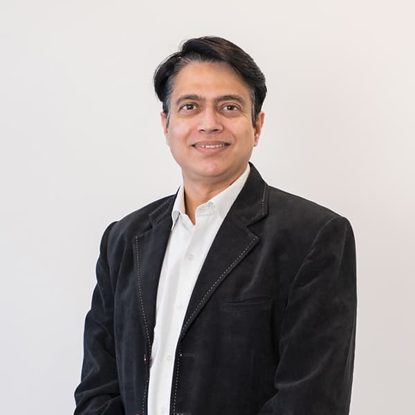 Dr Rajeev Bhandare portrait at Exquisite Smiles
